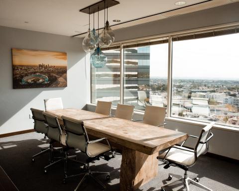 boardroom table in high rise office with view
