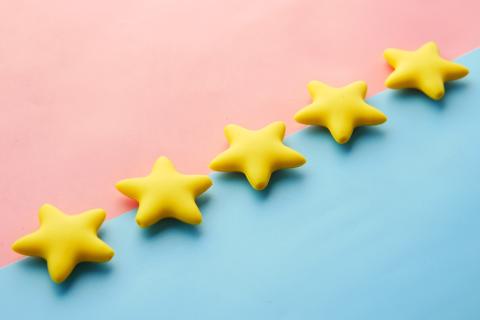 image of 5 yellow stars on a coloured background
