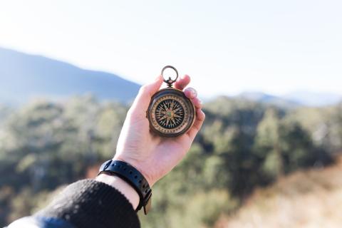 Person holding compass