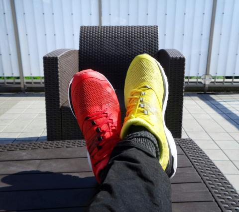 Pair of trainers, one yellow and one red